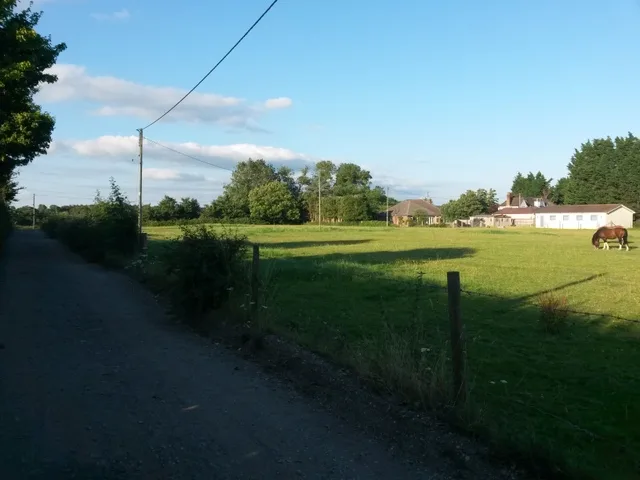 Fields beside Yeomans Road at Throop, on Bournemouth's northern edge. The council's papers say Green Belt urban extensions could come in north Bournemouth, but they do not yet name any sites, and this photo does not show one